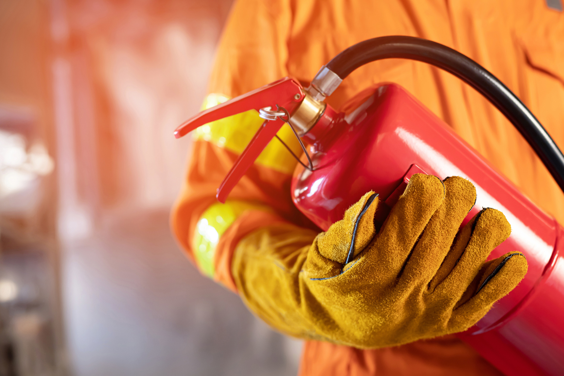 Fireman Holding Fire Extinguisher